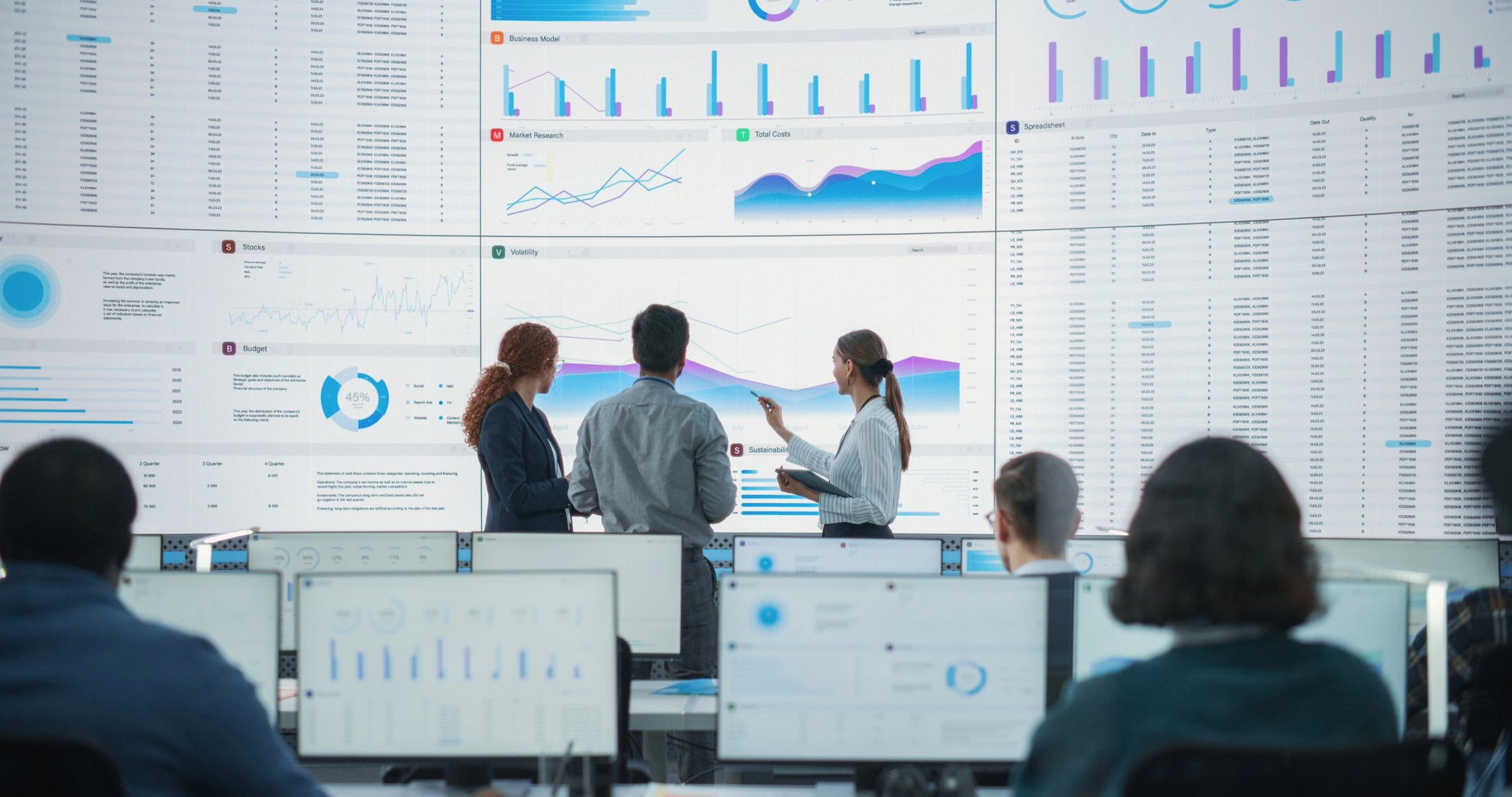 Team reviewing analytics dashboards in a modern office